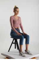  Kate Jones  1 blue jeans casual dressed pink long sleeve t shirt sitting white sneakers whole body 0006.jpg